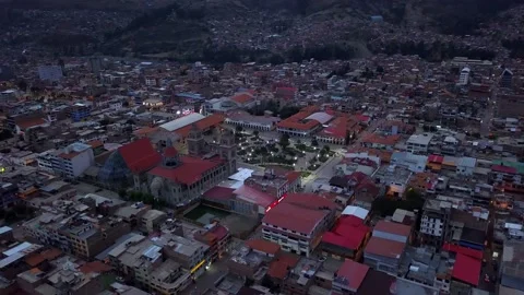 Aerial view from drone approaching the central square of Huaraz over houses at Stock Footage 164580698