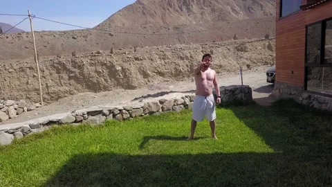 Aerial view of drone approaching a man and getting scared thinking that he would Stock-Footage 199571264