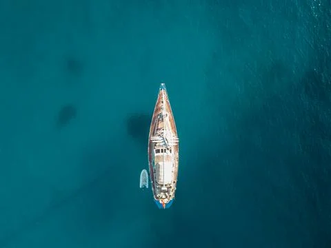 Aerial view drone boat docked mediterranean tropical beach Spain Cala en Porter Stock Photos