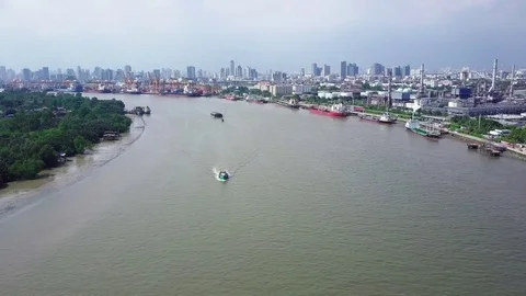 Aerial view from a drone of the Chao Phraya river with small sand carrier barges Stock Footage 75115949