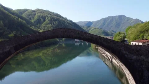 Aerial view with drone on the devil's bridge in a spring day. Borgo a Mozzano Stock Footage 232288503
