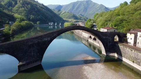 Aerial view with drone on the devil's bridge in a spring day. Borgo a Mozzano Stock Footage 232289220