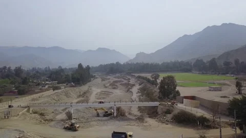 Aerial view with drone of a dry river with machines working  Stock Footage 143936862