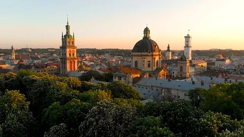Aerial view drone flight above the roofs on sunset Video stock 107994066