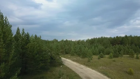 Aerial view, drone flight over the country road and forest to quarry Stock Footage 94600406