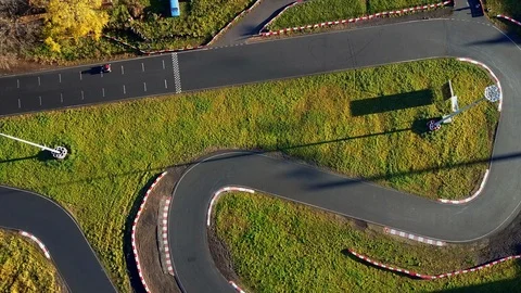Aerial view; drone flight over kart racing or karting, buggy cross Stock Footage 98737693