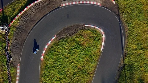 Aerial view; drone flight over kart racing or karting, buggy cross Stock Footage 98738439