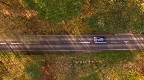 Aerial view drone fly - a car drive on a road in germany Stock Footage 62935071