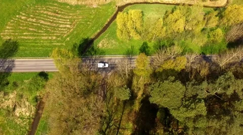 Aerial view drone fly - a car drive on a road in germany Stock Footage 62941059