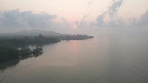 Aerial view of drone fly to sun rise with red yellow color in the morning Video stock 153408749