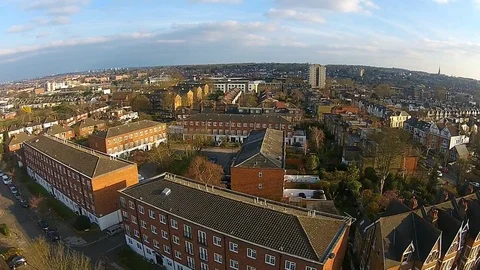 Aerial view of drone flying above houses in a London suburb Stock Footage 80291380