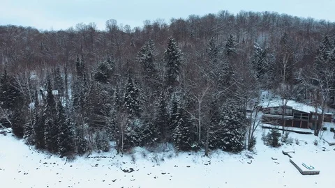 Aerial view from drone flying above Eagle Lake on a cold winter day, Canada Stock Footage 99990318