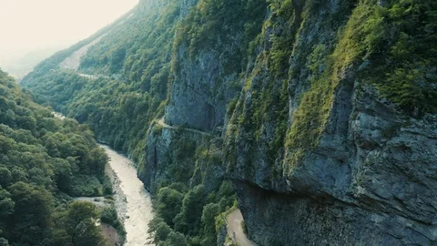 Aerial view; drone flying between two stony walls Stock Footage 118299407
