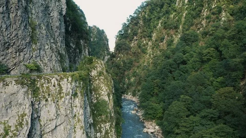 Aerial view; drone flying between two stony walls Stock Footage 118299833