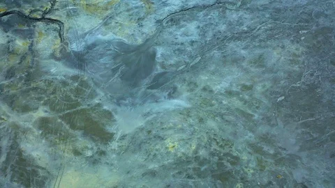 Aerial view; drone flying forward over a polluted river with destroyed ecosystem Stock Footage 118284201
