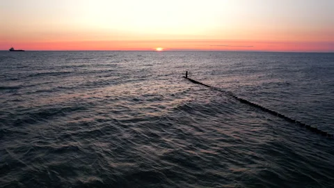 Aerial view of drone flying forward over Baltic sea at sunrise Vídeos de archivo 338140030