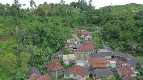 Aerial View of Drone Flying Low Over Remote Village Houses Stock Footage 343858642