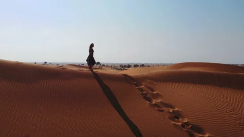 AERIAL. View from a drone flying next to a woman in abaya United Arab Stock Footage 100868393