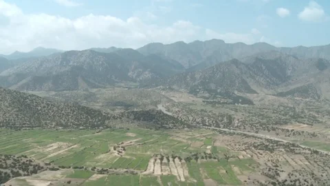 Aerial view from a drone flying over the afghan fields Stock Footage 86295899