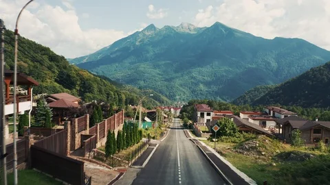 Aerial view; drone flying over streets of mountain village Stock Footage 117430170
