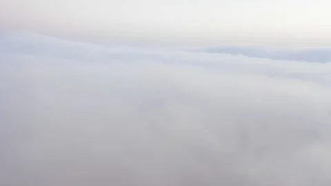 Aerial view of a drone flying over thick white fog clouds. Stock Footage 126282757