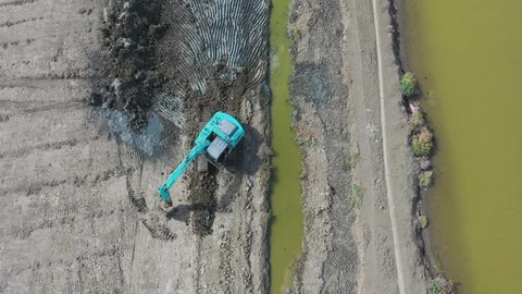 Aerial view of Drone flying over Excavator machine digging soil working-DJI Stock Footage 129859080