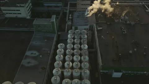 Aerial view of a drone flying over the beer production plant, several rows of Stock Footage 155300979