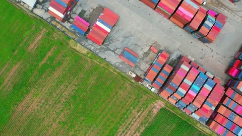Aerial view from a drone flying over a many cargo containers Stock Footage 210787035