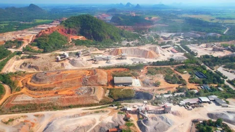 Aerial view from a drone flying over a quarry in the tropics Stock Footage 225390260