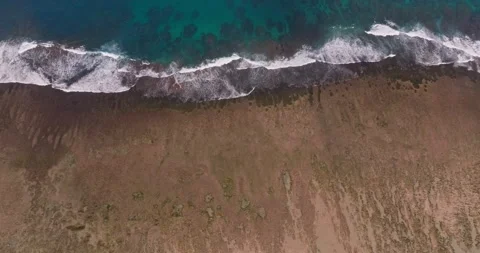 Aerial view of a drone flying over beautiful ocean waves and water crashing. Stock Footage 252491100