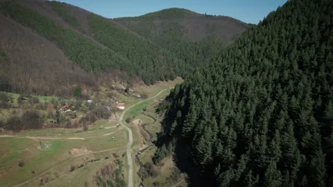 Aerial view from drone flying over a mountain road in Cindrel Mountains, Romania Stock Footage 270049876