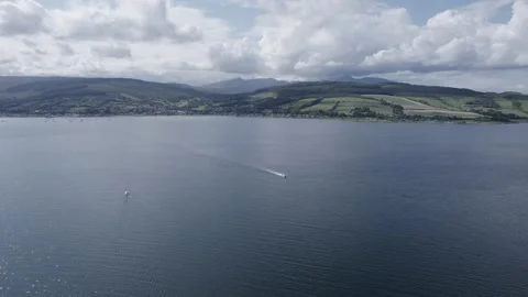 Aerial view, drone flying over a Isle Of Arran aerial shot with speedboat Stock Footage 278009954