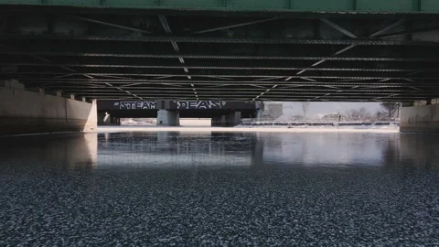 Aerial view of drone flying under bridge Stock Footage 172102328