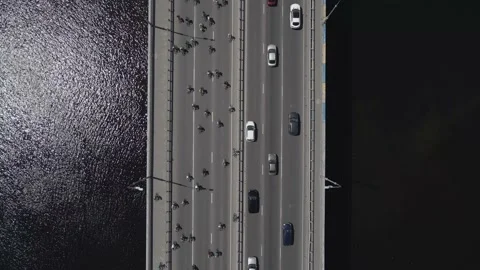Aerial view from a drone to a group of cyclists on bicycles ride on the road Stock Footage 158258836