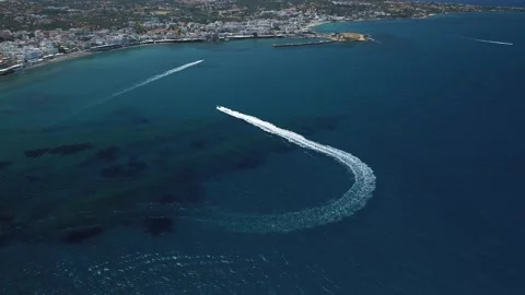 Aerial view by drone of idyllic seascape with jet boat on Crete, Greece. Stock Footage 198524929