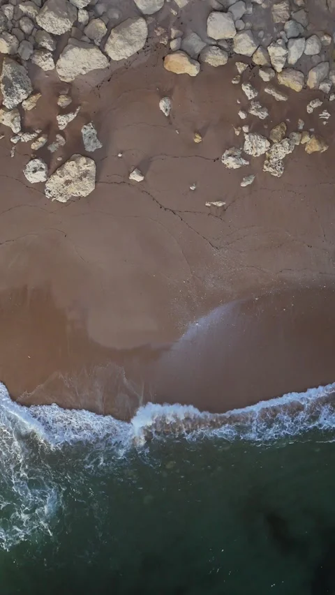 Aerial view of a drone inside Benagil Cave flying up out of the cave and showing Stock Footage 318847570