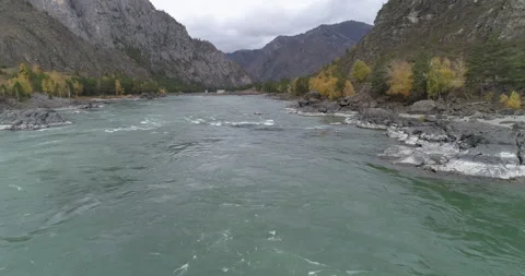 Aerial view from drone of Katun mountain river flowing along rocky terrain Stock Footage 143905708