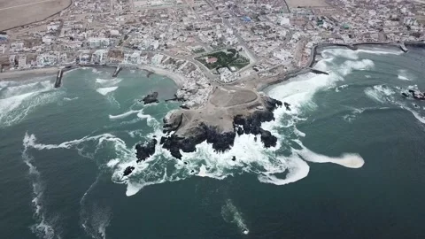 Aerial view with drone of a large rock on the sea coast of san bartolo, peru Stock-Footage 143379386