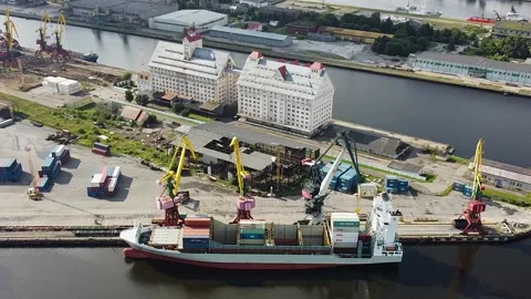 Aerial view from a drone of loading containers into a large cargo ship Stock Footage 194018934
