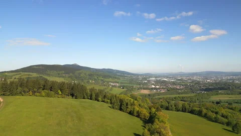 Aerial view from drone of lush meadows, rolling hills and Jested Mountain Stock Footage 310718557