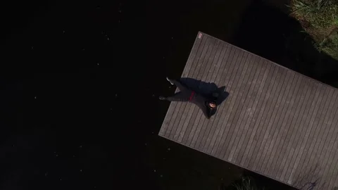 Aerial View With a Drone Of a Man Lying On a Pontoon Stock Footage 143649509