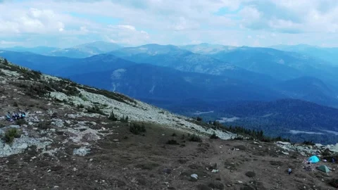 Aerial view from drone on mountain forest and peak of blue rock range. Stock Footage 141025599