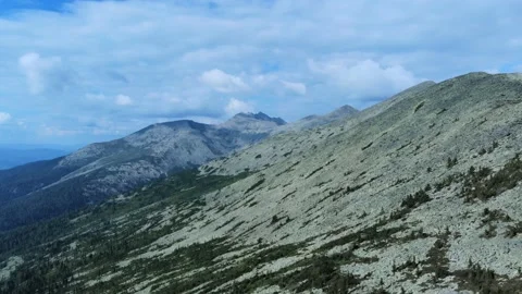 Aerial view from drone on mountain forest and peak of blue rock range. Stock Footage 141025763