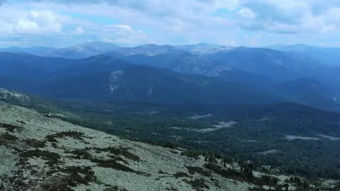 Aerial view from drone on mountain forest and peak of blue rock range. Stock Footage 141025771
