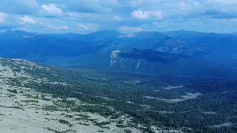 Aerial view from drone on mountain forest and peak of blue rock range. Stock Footage 141026122