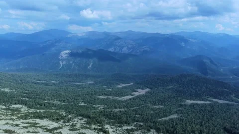 Aerial view from drone on mountain forest and peak of blue rock range. Stock Footage 141026138