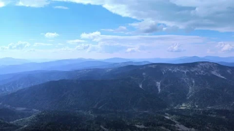 Aerial view from drone on mountain forest and peak of blue rock range. Stock Footage 141026228