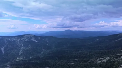 Aerial view from drone on mountain forest and peak of blue rock range. Stock Footage 141026343