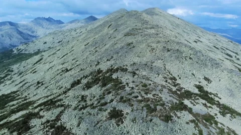 Aerial view from drone on mountain forest and peak of blue rock range. Stock Footage 141026446