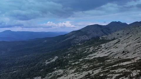Aerial view from drone on mountain forest and peak of blue rock range. Stock Footage 141026517